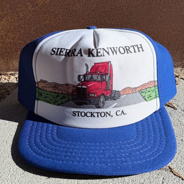 American Specialties Sierra Kenworth Trucker Snapback Hat Blue White