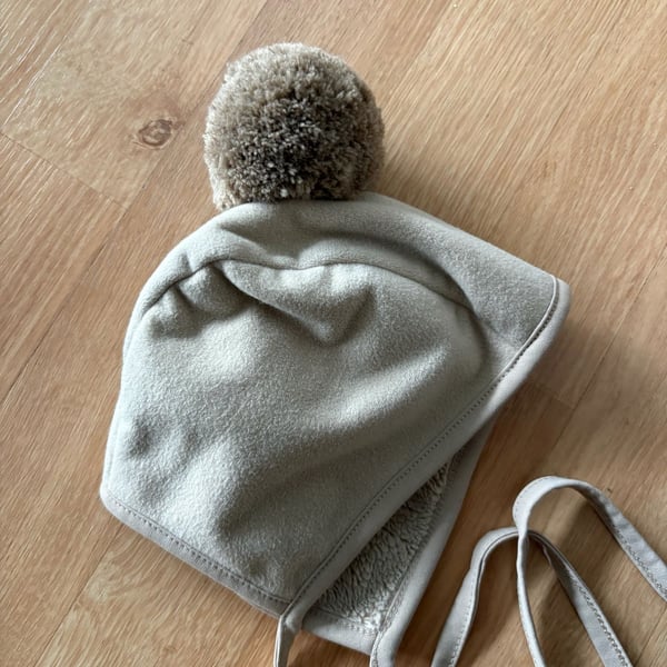 Konny Winter Bonnet Size 6M Beige Fleece Pom-Pom
