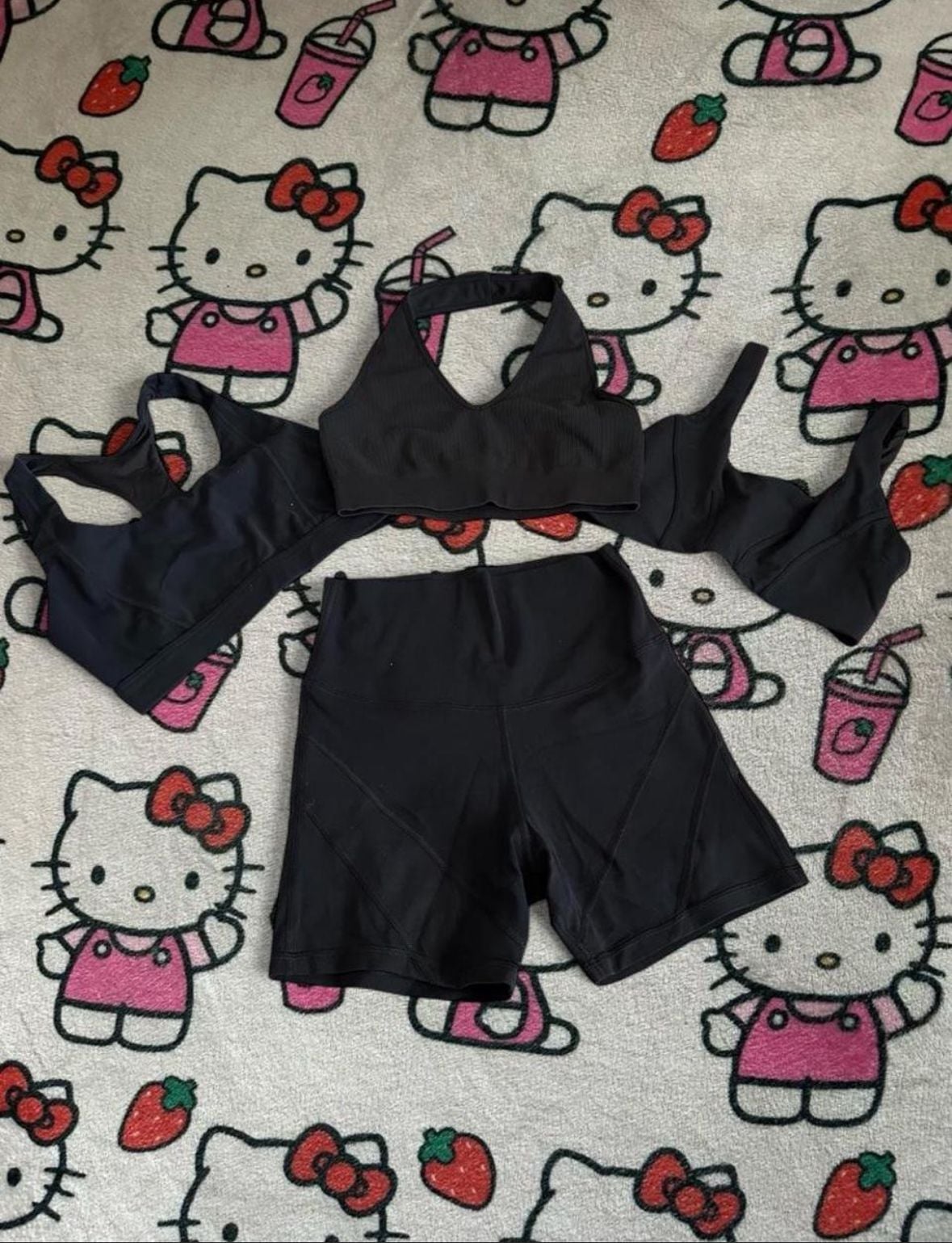 Black Athletic Activewear Set Including Ribbed Halter Crop Top, Sports Bra, and High-Waisted Biker Shorts 1