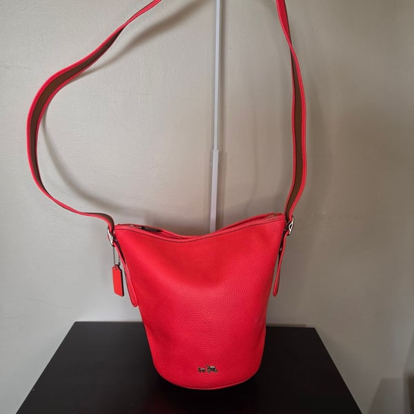 Coach Polished Pebble Leather Mini Duffle crossbody, neon pink