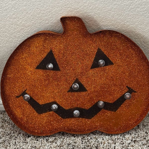 Metal-framed Orange Glitter, Color Changing LightUp Jack O’Lantern Marquee Sign