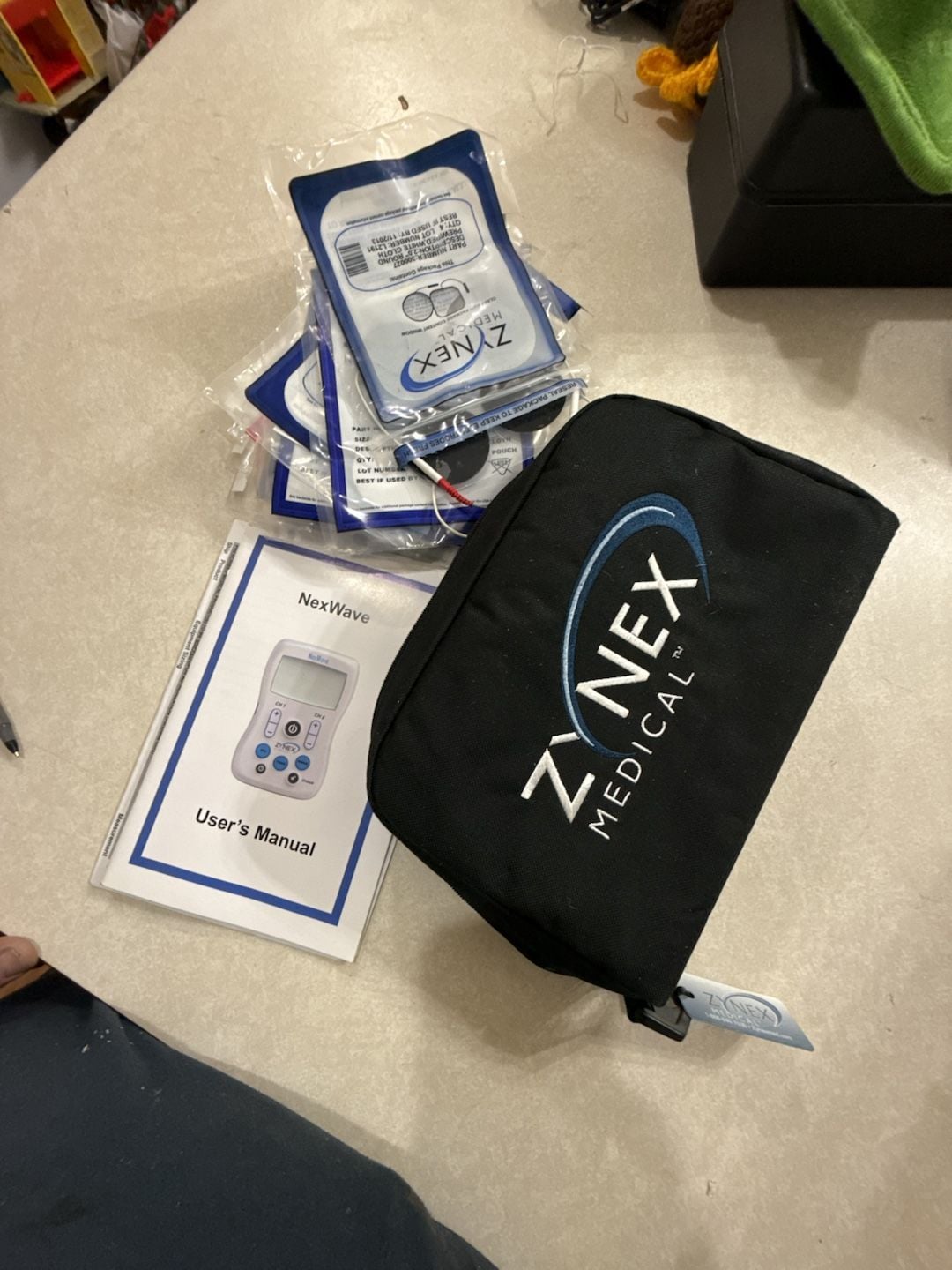 Zynex Medical NexWave TENS NMES Device With Case and Electrodes 1