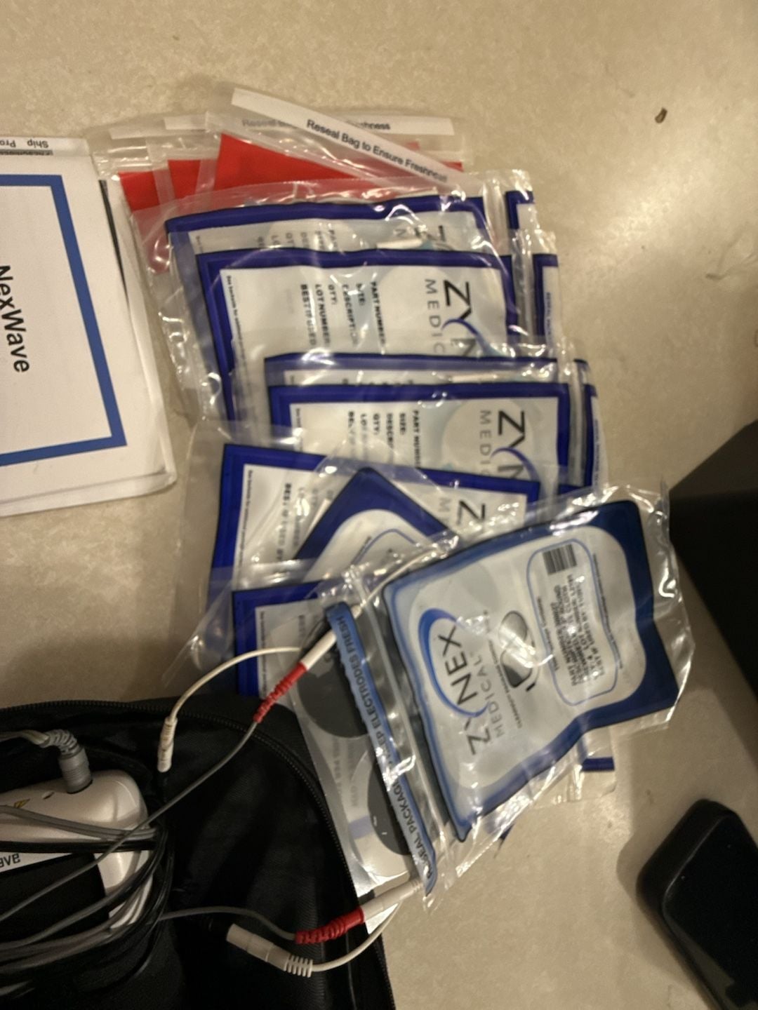 Zynex Medical NexWave TENS NMES Device With Case and Electrodes 4