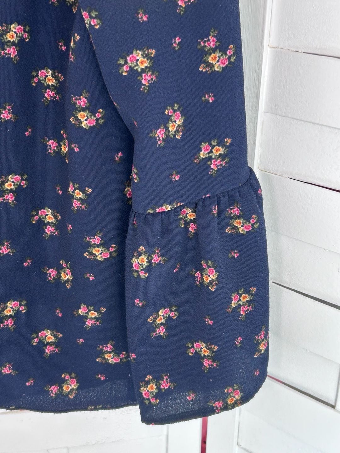 Orange Creek boho navy floral long sleeved blouse with ruffle collar and hem. 5