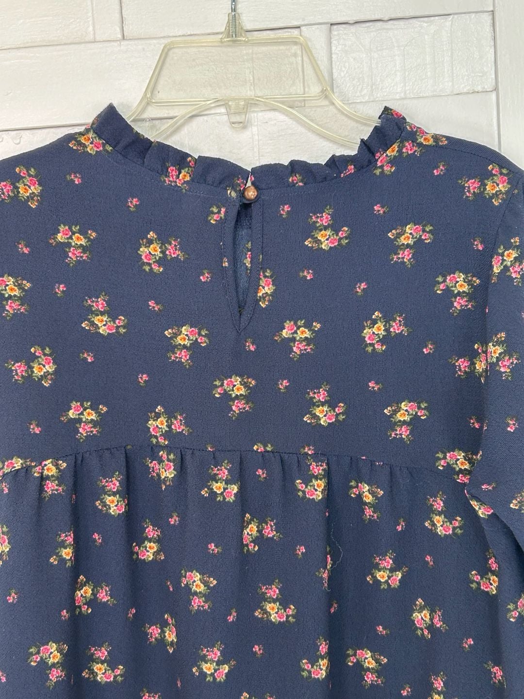Orange Creek boho navy floral long sleeved blouse with ruffle collar and hem. 6