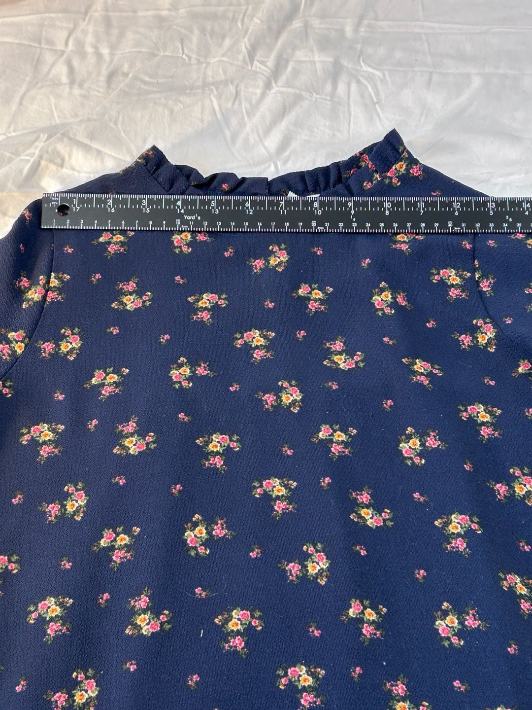 Orange Creek boho navy floral long sleeved blouse with ruffle collar and hem. 8