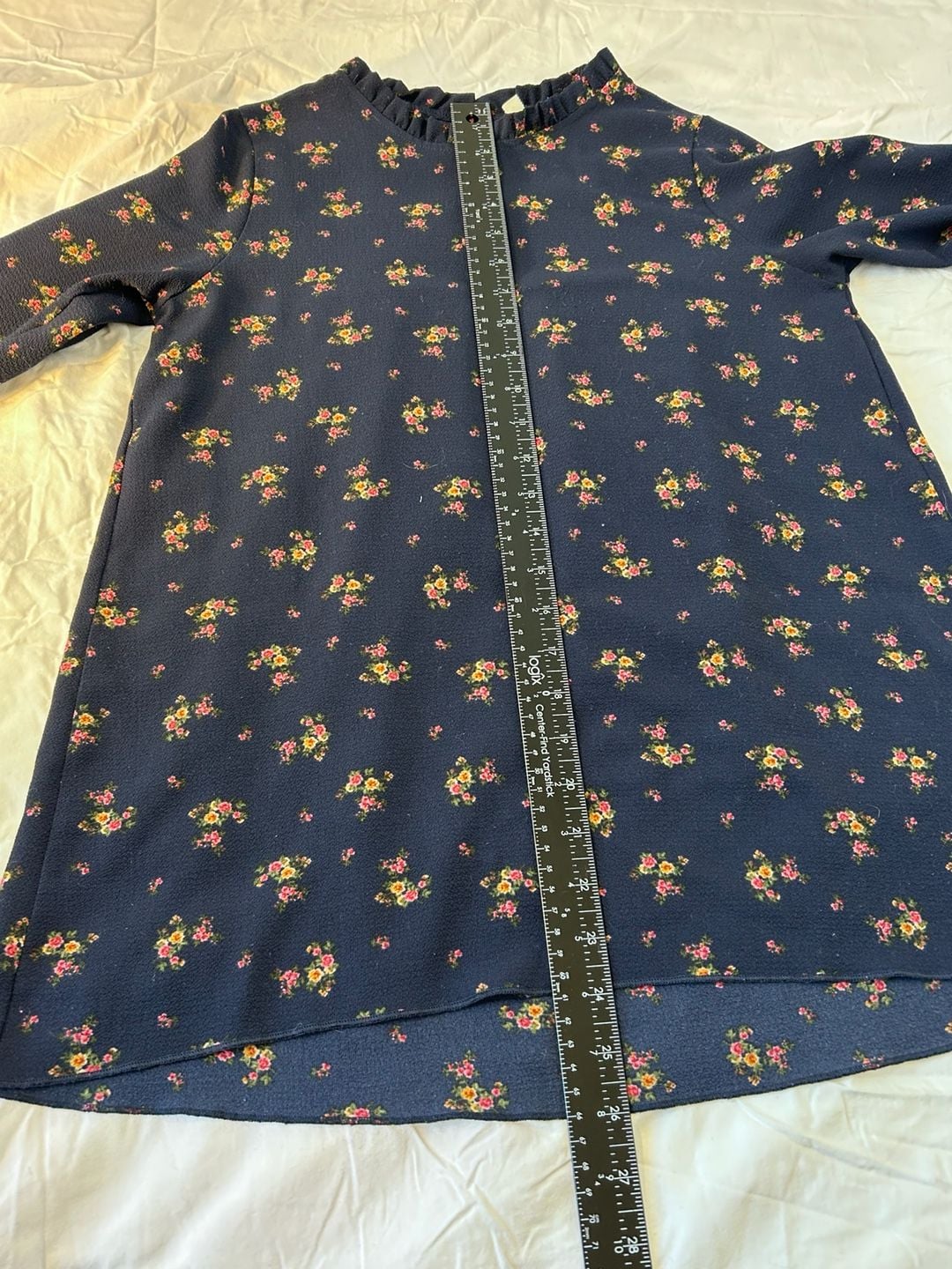 Orange Creek boho navy floral long sleeved blouse with ruffle collar and hem. 11
