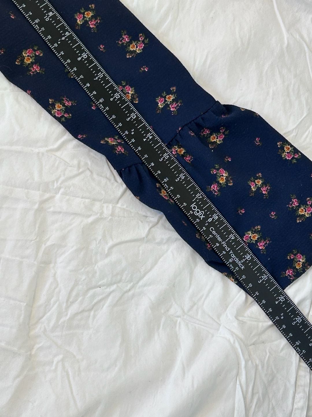 Orange Creek boho navy floral long sleeved blouse with ruffle collar and hem. 12