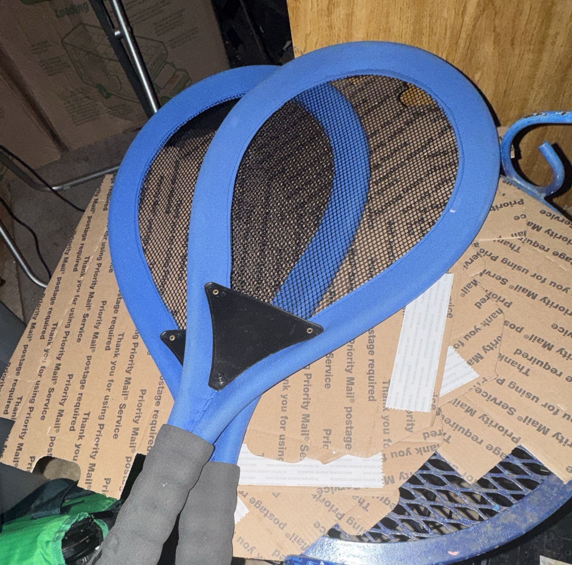 Blue Mesh Tennis Racket with Black Grip and Metal Plate 1