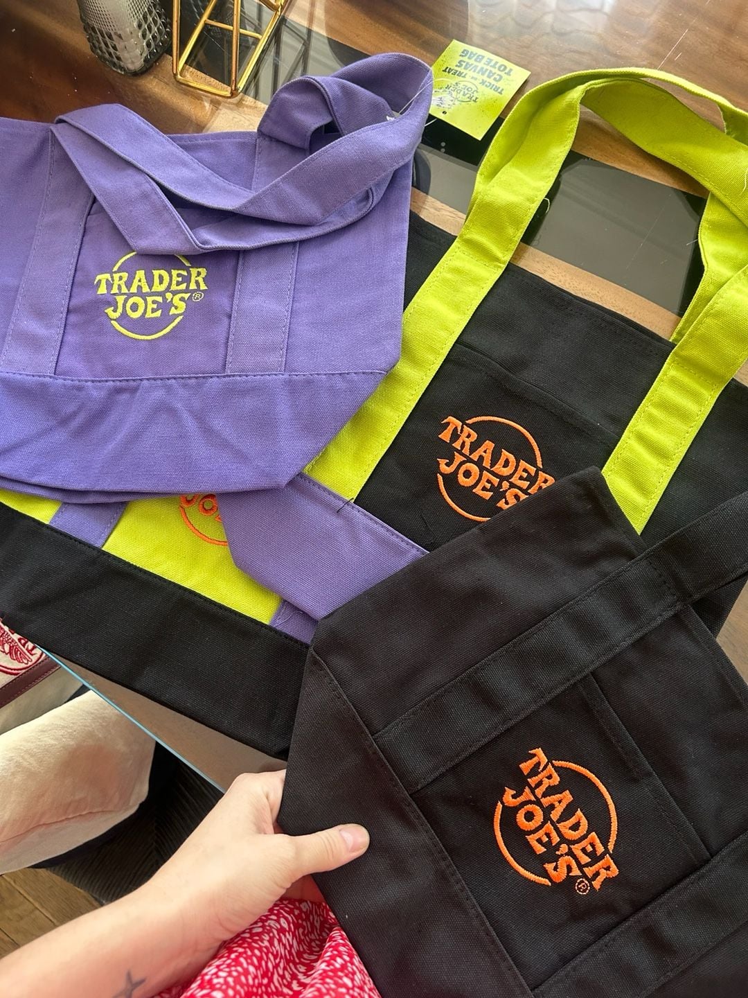 Trader Joe's Halloween Tote Bag Set of 2 Black, Purple Canvas and Neon lime green color featuring purple straps and black bottom panels . 1