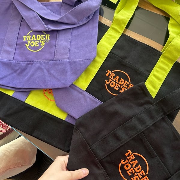 Trader Joe's Halloween Tote Bag Set of 2 Black, Purple Canvas and Neon lime green color featuring purple straps and black bottom panels .