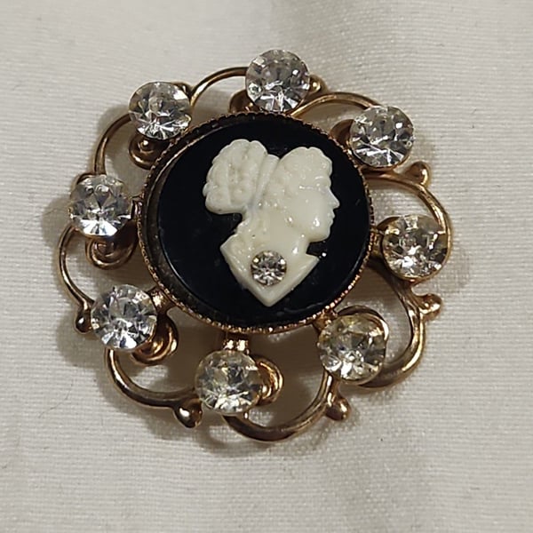 Vintage Gold Tone Cameo Brooch with Rhinestones and Black Background