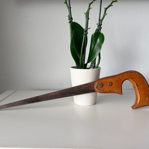 Vintage Keyhole Saw with Wooden Handle and Rusty Blade