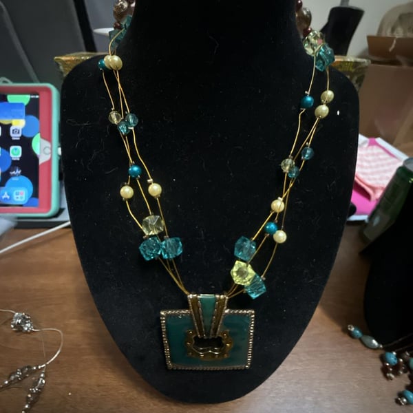 Multi Strand Glass Beaded Necklace with Turquoise Pendant and Gold Accents