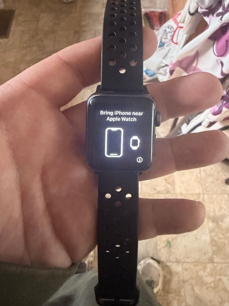Apple Watch with Black Perforated Sport Band 1