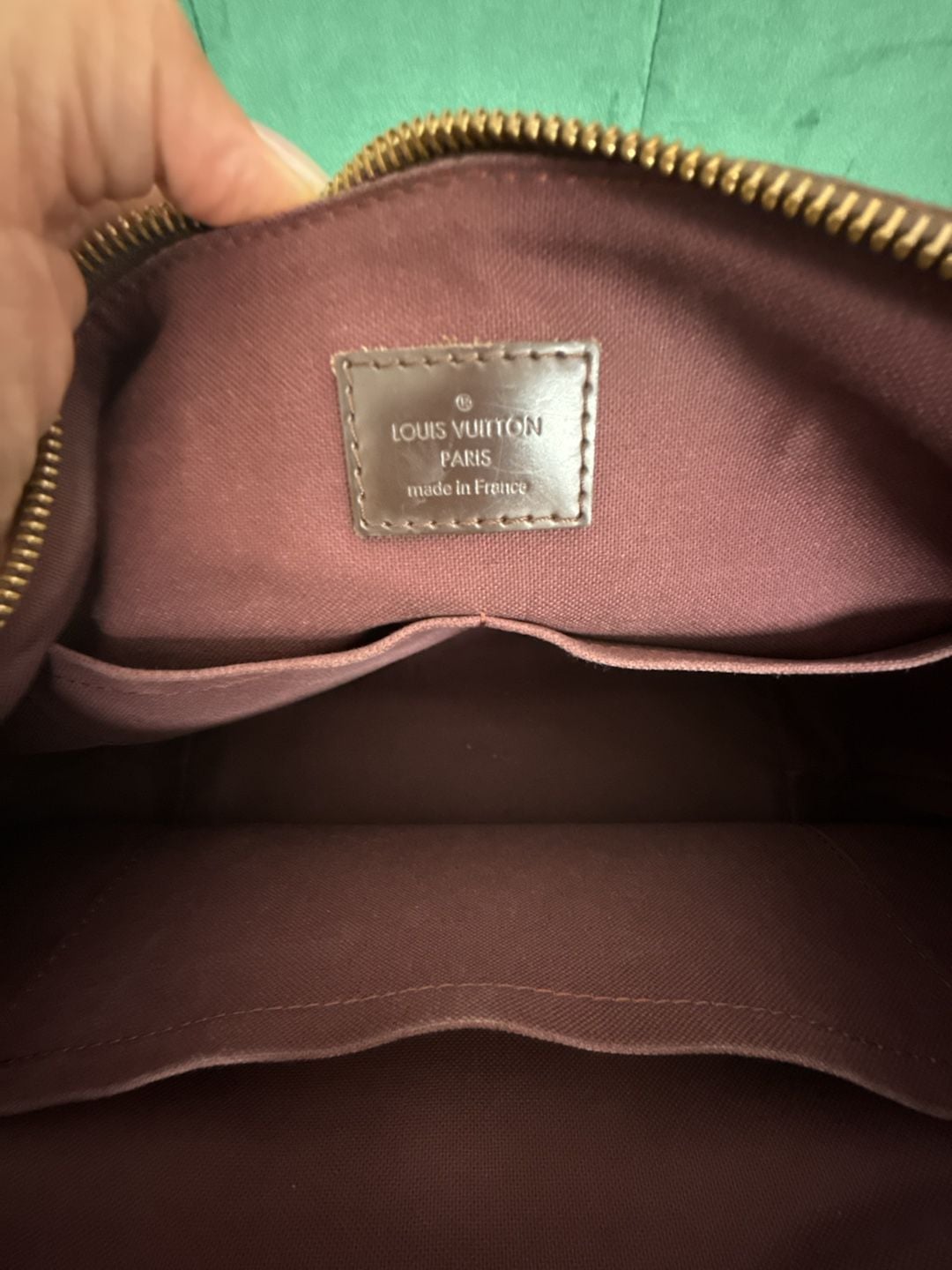 Louis Vuitton Damier Ebene Iena shoulder bag crafted in the signature brown checkerboard coated canvas with gold-tone hardware and a front zippered pocket. 7