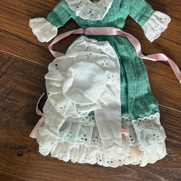 Vintage Doll Green Dress And White Bonnet With Pink Ribbon