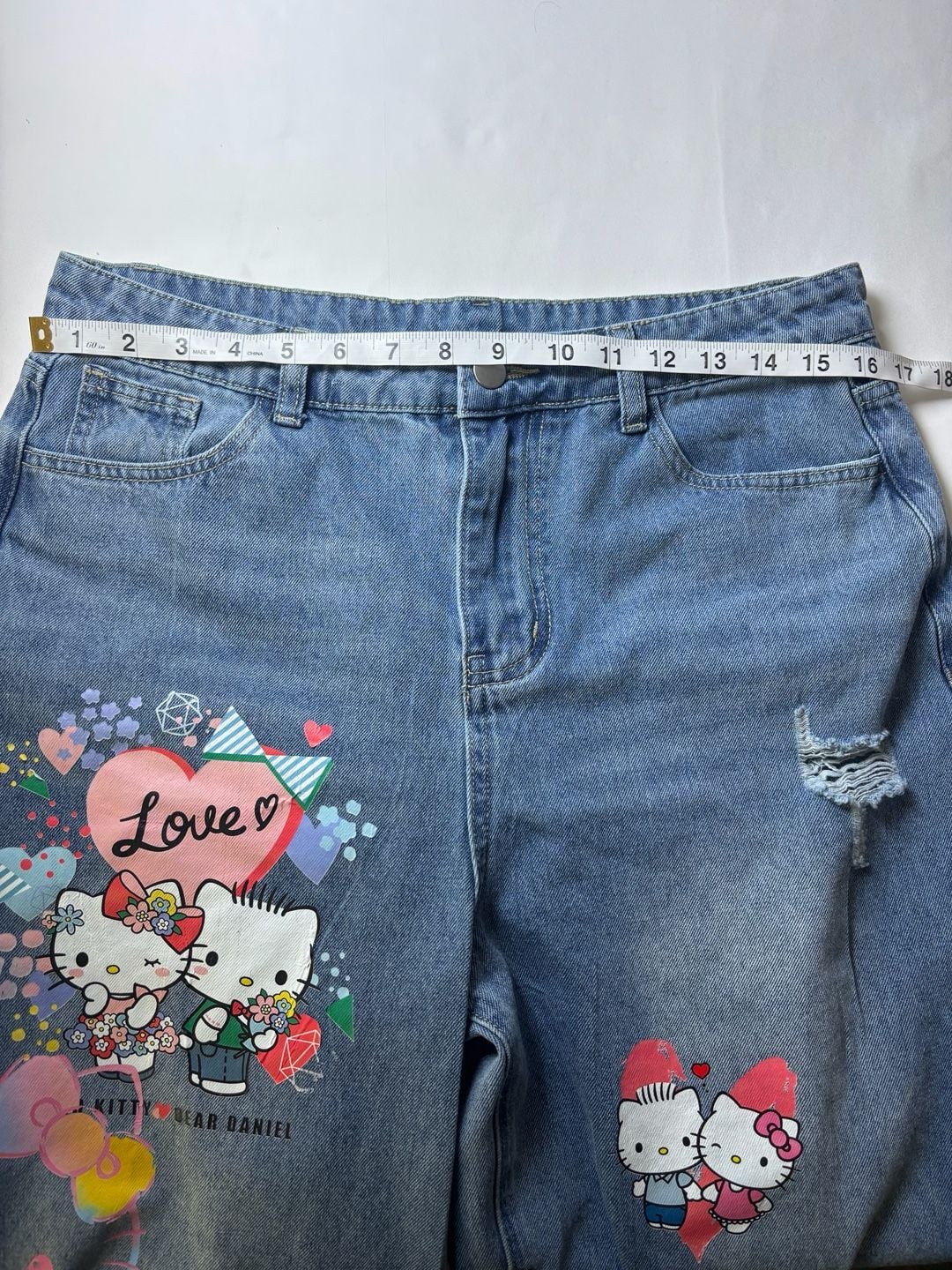 Denim blue/Hello Kitty Charm-detail wide-leg jeans 11
