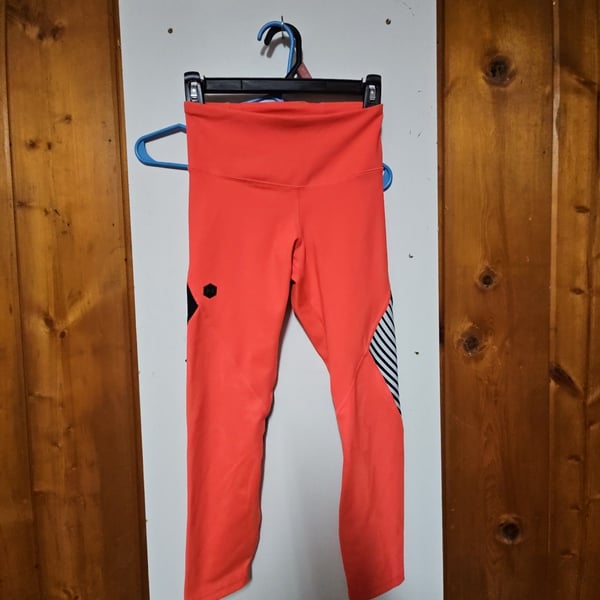(543) Under Armour Rush Embossed Shine Leggings Orange