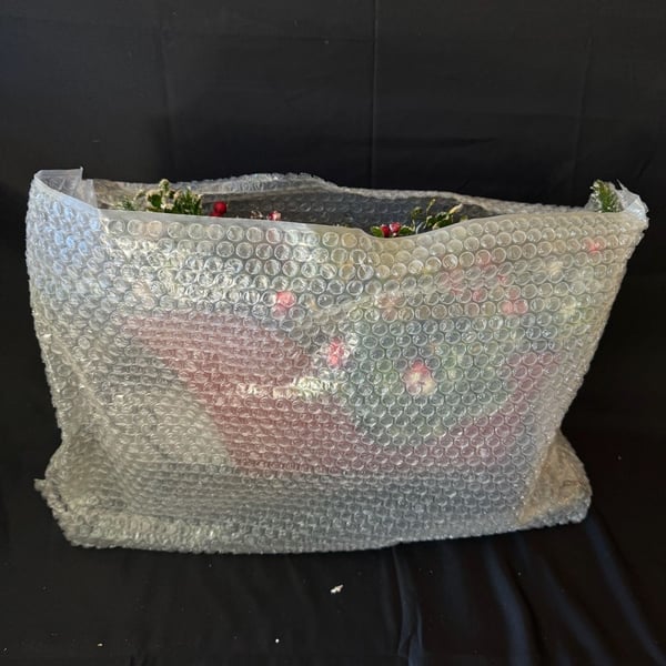 Valerie Metal Sleigh Centerpiece With Christmas Florals And Pinecones