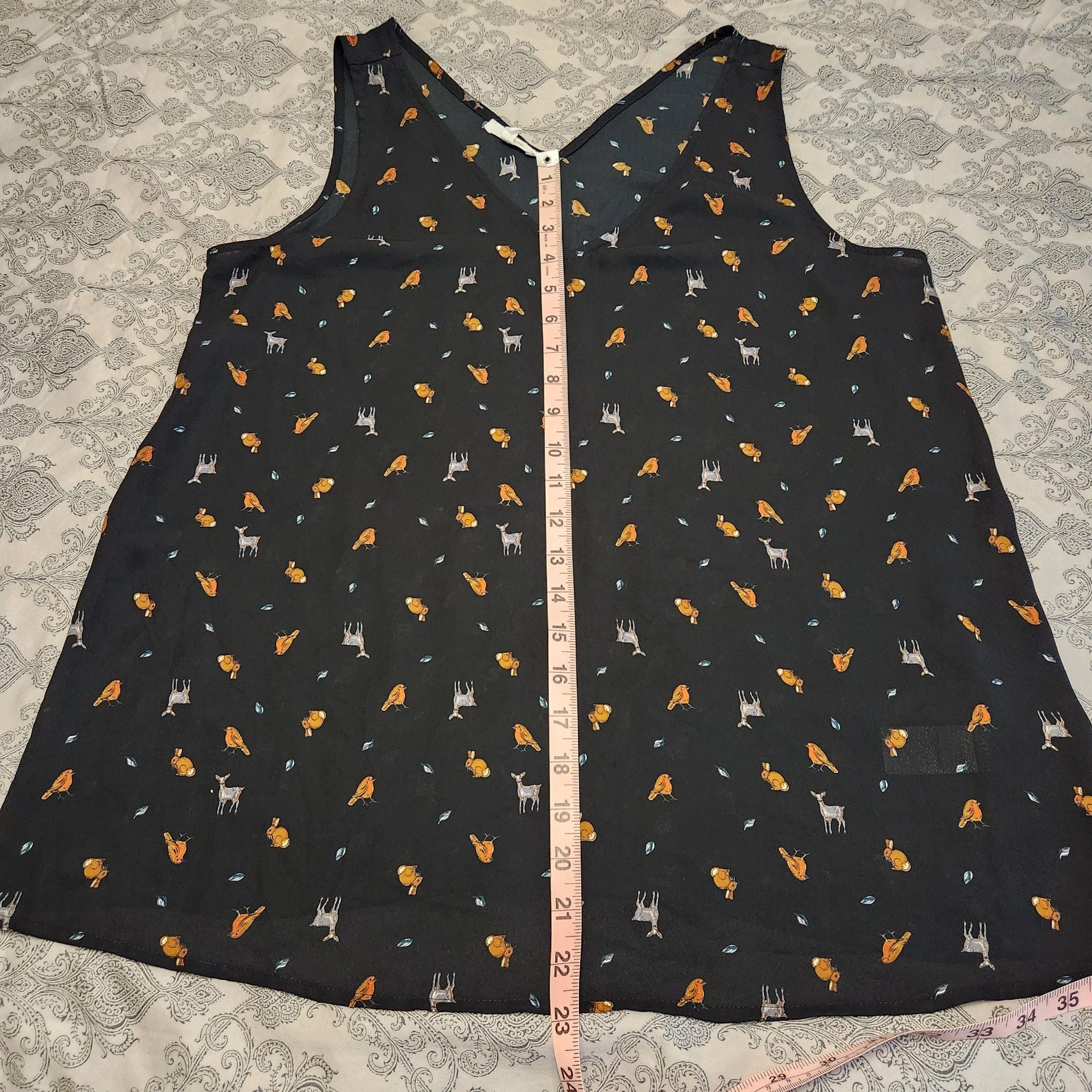 Women's Sleeveless Animal Print V-Neck Blouse 9