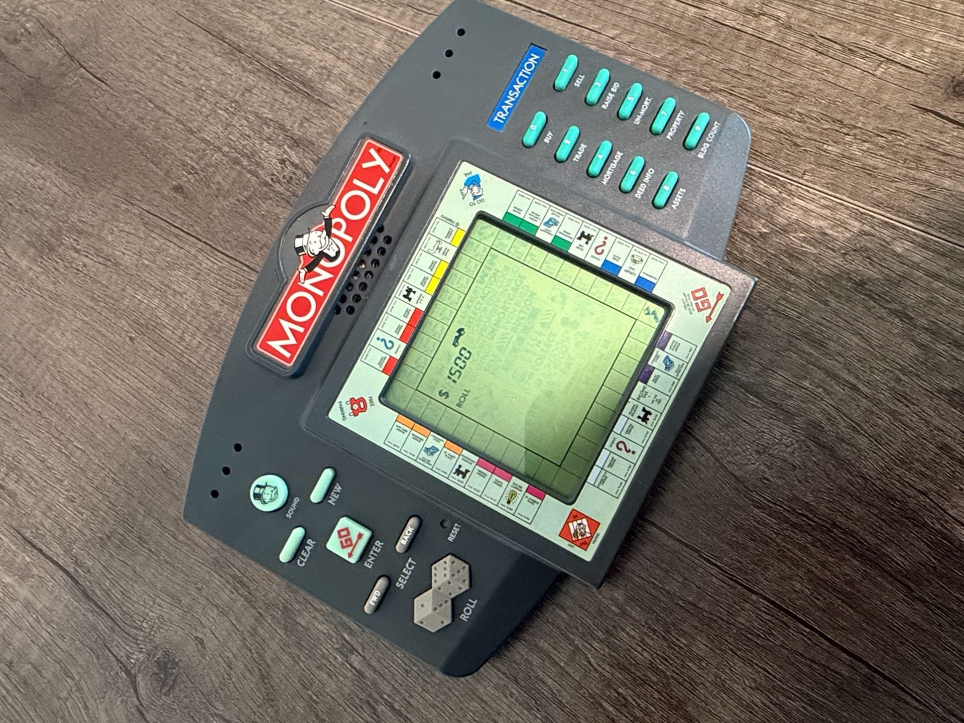 Hasbro Electronic Monopoly Handheld LCD Game Unit 1997 4