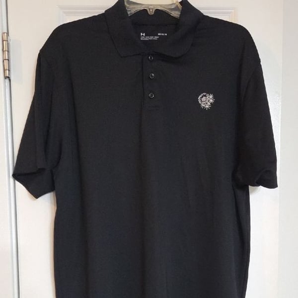 Black Under Armour polo shirt. Retails For $40 to $95 (See Pic)