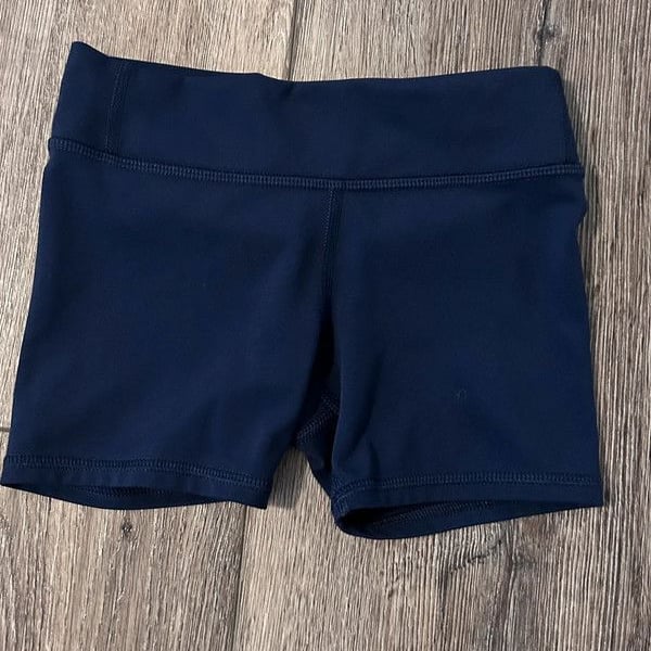 Cute girls pull on shorts
