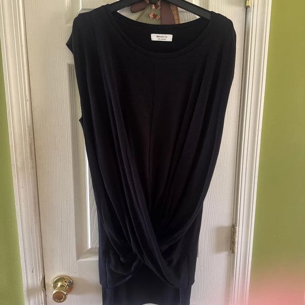 It is a sleeveless, crew-neck top dress