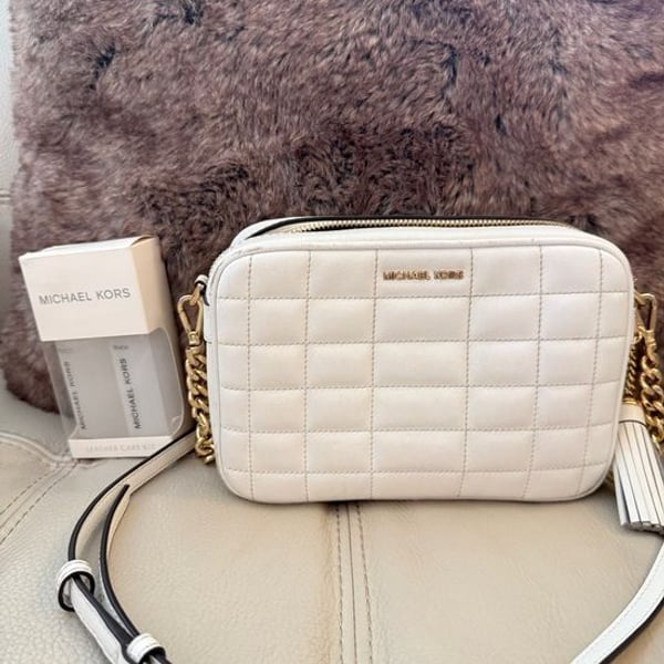 Michael Kors Quilted Leather Crossbody purse with tassel and Gold Chain