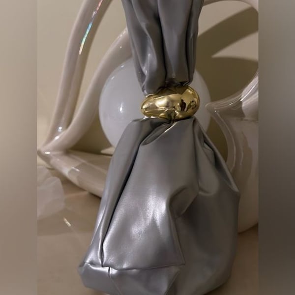A Classy Chic Boutique Silver Mini Knot Bag with Gold Accent