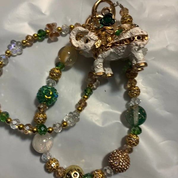 Gold tone beaded white elephant bag charm chain